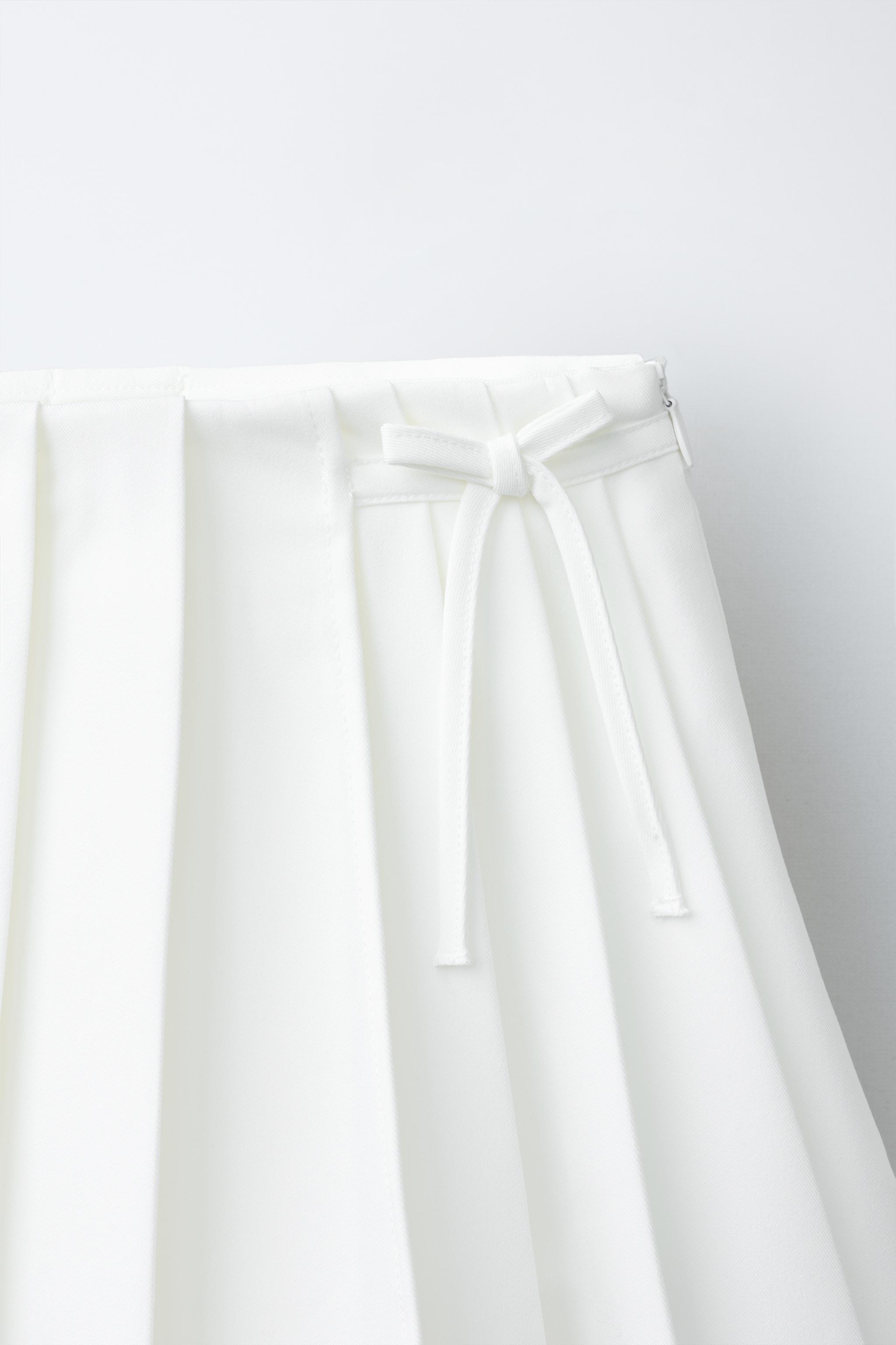 PENN © ASYMMETRIC PLEATED SKIRT